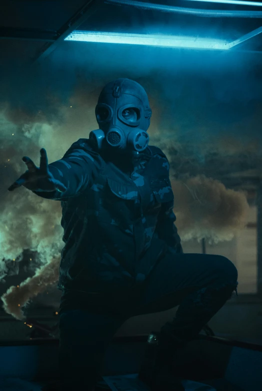 a man in a gas mask with his hands out