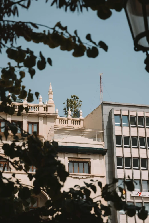 a building with an airplane flying overhead the image appears to be from afar