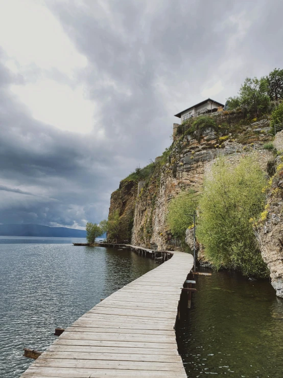 there is a boardwalk that leads into a water way