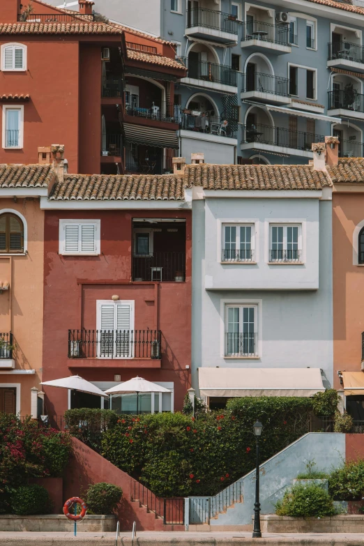 a row of buildings along the water in a city