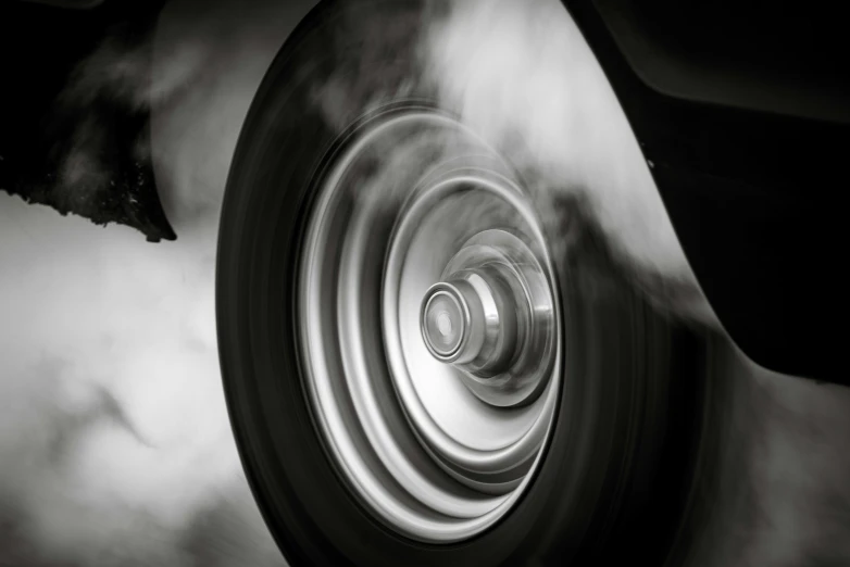 black and white pograph of a wheel on a vehicle