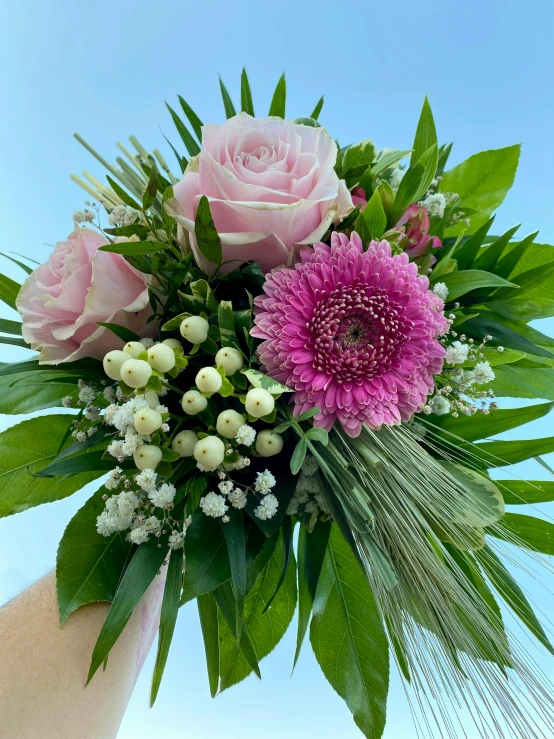 a vase filled with lots of different flowers