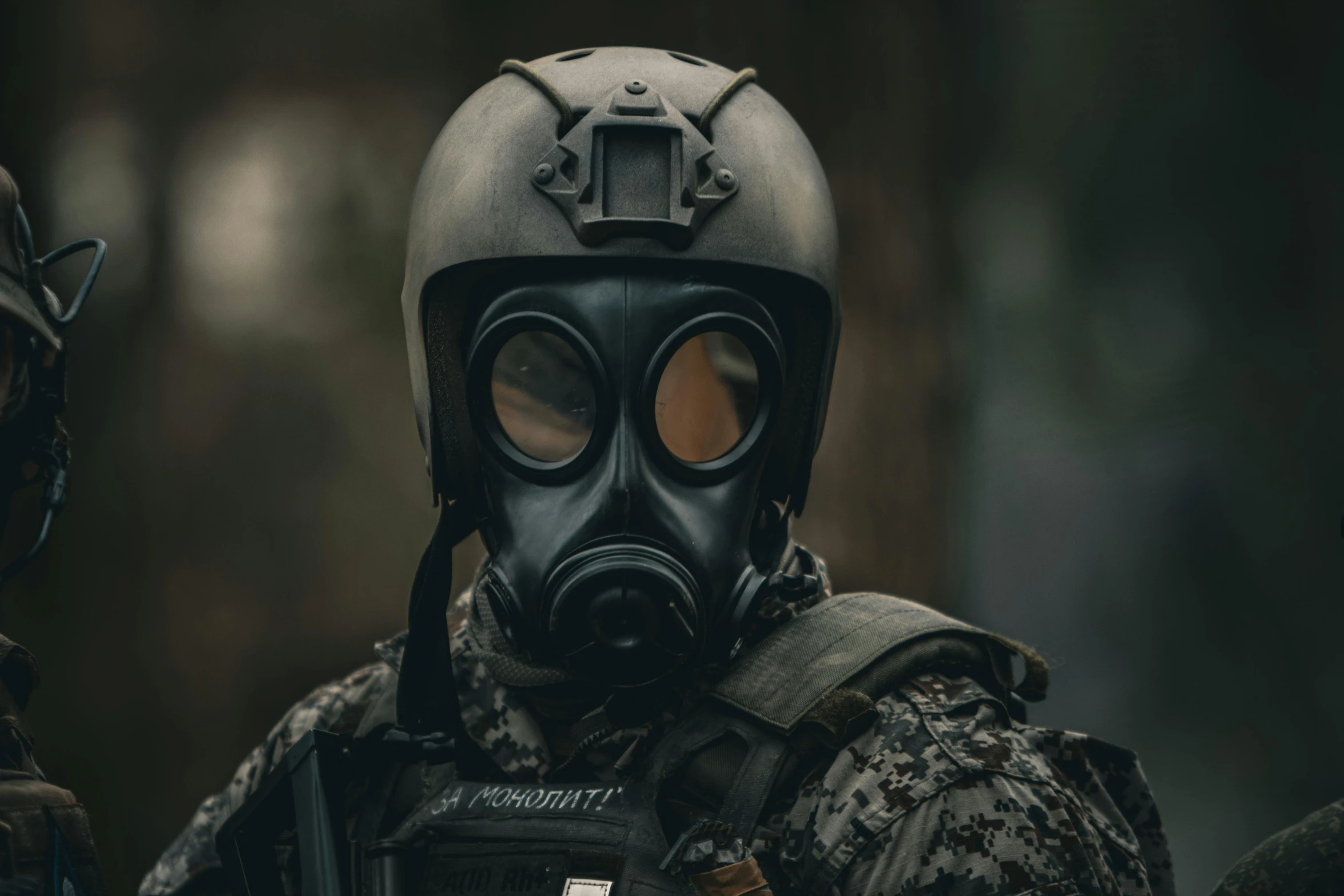 a soldier wearing a gas mask in the woods