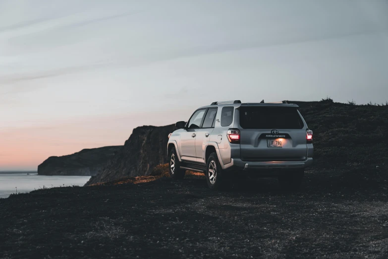 a vehicle that is sitting near the ocean