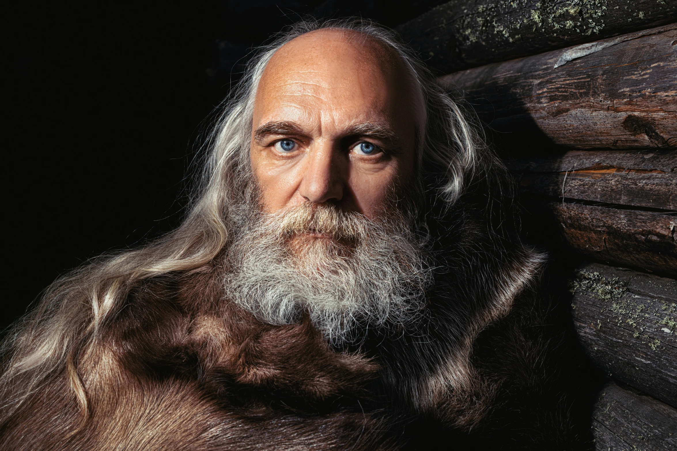 a close - up portrait of a bearded man with a beard