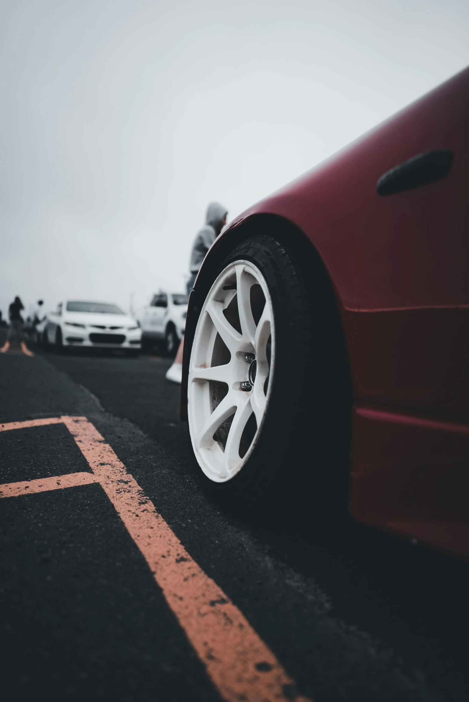 there is a red sports car parked in the street