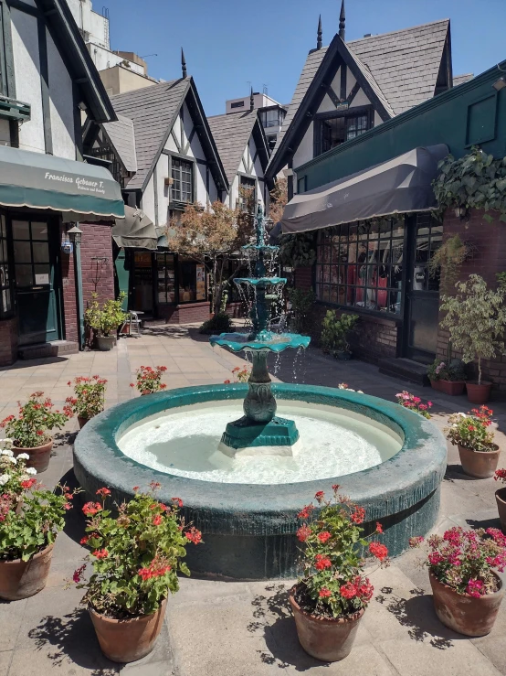 the fountain is in the middle of the yard