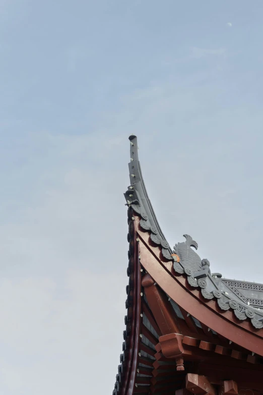 a view of an architectural roof that appears to have a pointed top