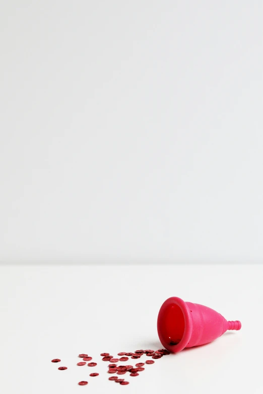 a group of spilled objects sit on top of a white table