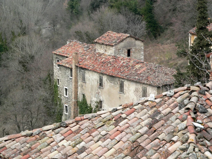 the top view of a rustic old house in the mountains