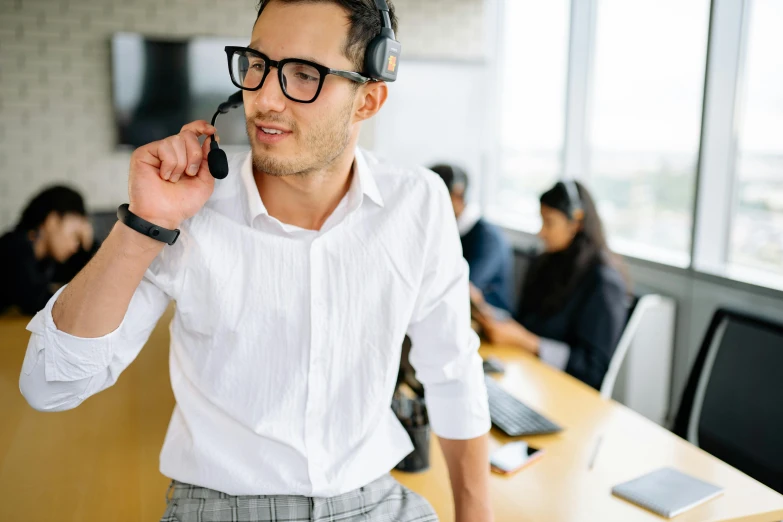 a man talking on his phone in an office