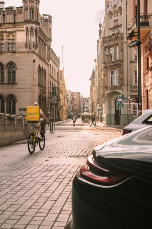 a man is riding his bicycle on the road