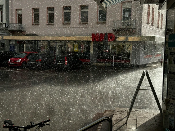 a rainy city street filled with lots of traffic