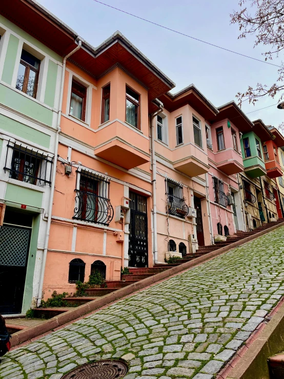 the narrow cobblestone streets are lined with colorful buildings