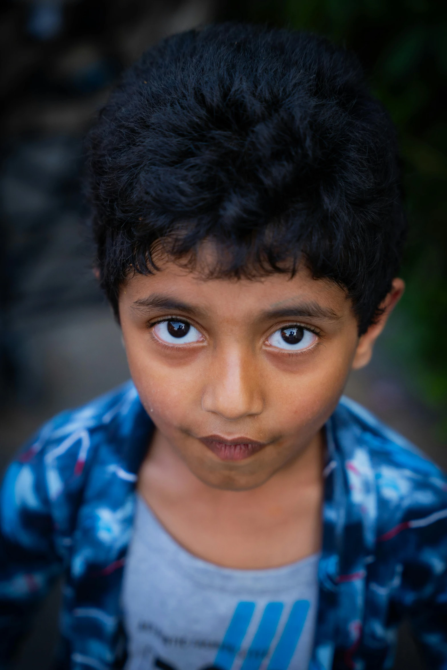 a close up of a person with a blue shirt