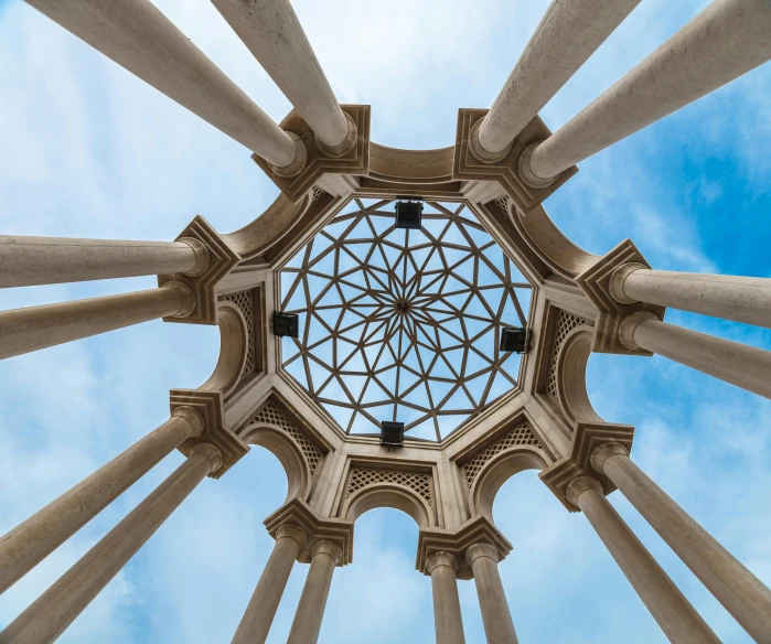 view looking up to the sky through a round steel structure