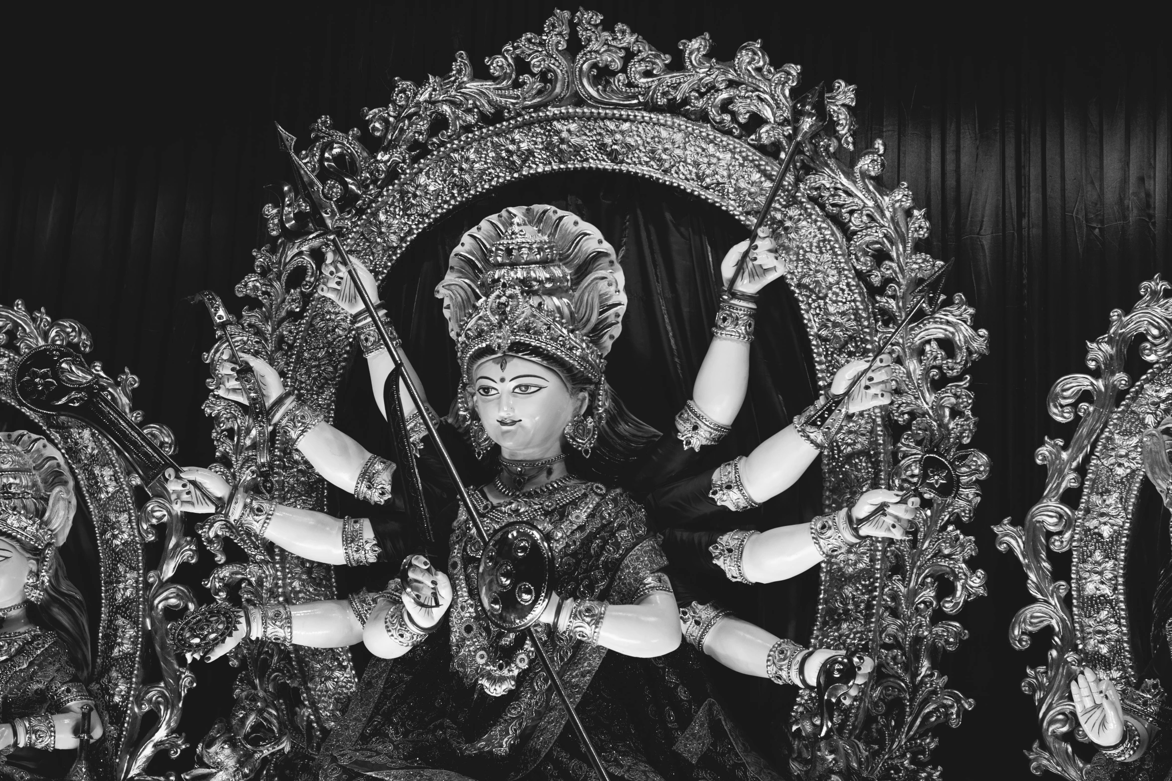 statues are adorned with intricate designs in black and white