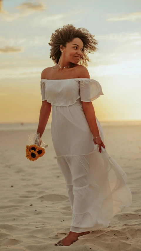 a woman in a white dress in the desert