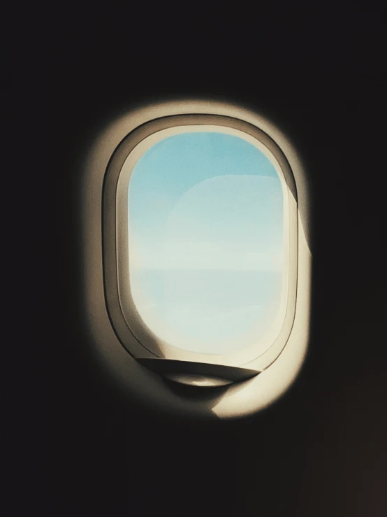 a window on an airplane flying in the air