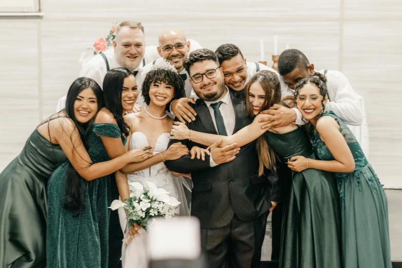 the bride and groom are holding their hands out