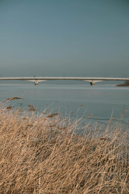 a long white bridge over a large body of water