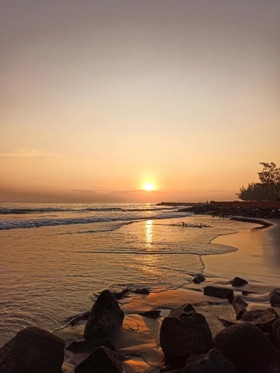 a view of the sun reflecting off the sea