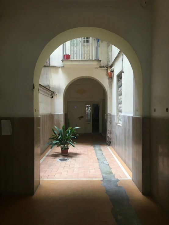 an archway to a building that is full of doors
