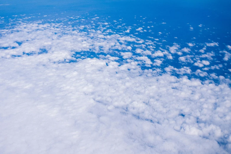 a large body of water with a lot of clouds