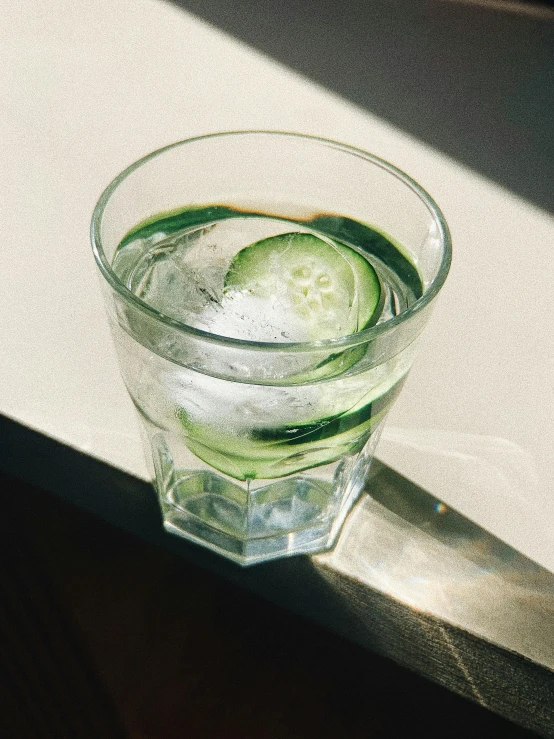 a cucumber is placed in a glass of water