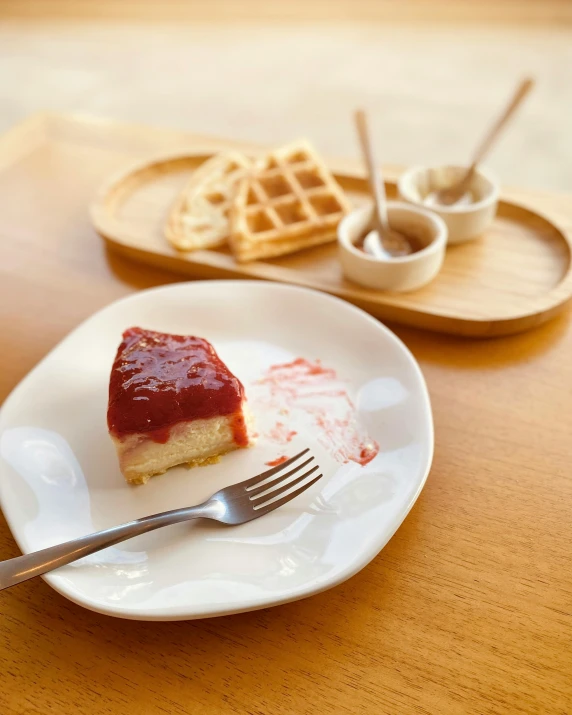 a white plate topped with jelly and a fork