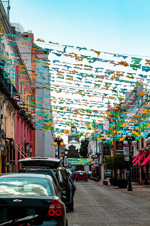 the city streets have many colorful flags on them