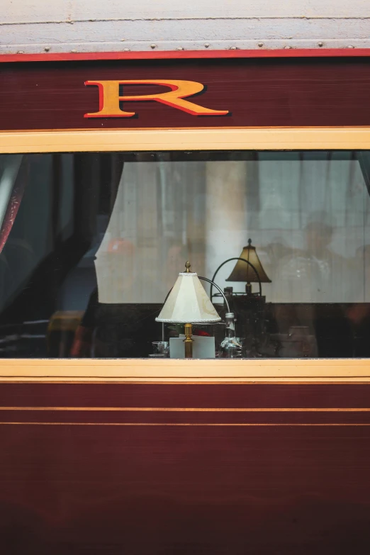 the lamp is next to the window on the side of the train