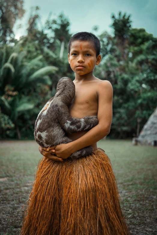 a man with his arm around a koala