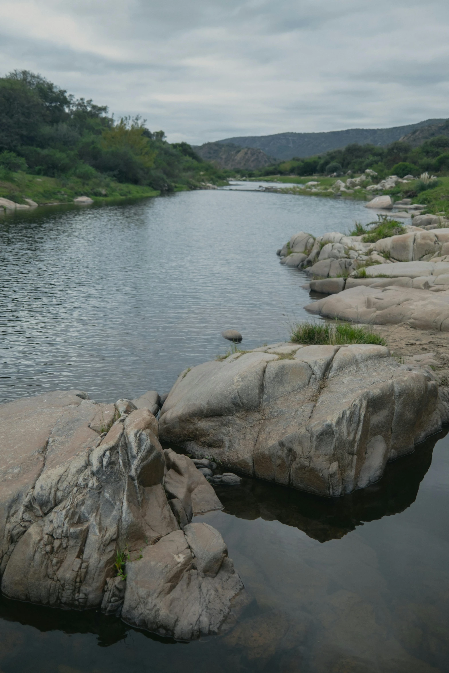 a body of water surrounded by lots of rocks