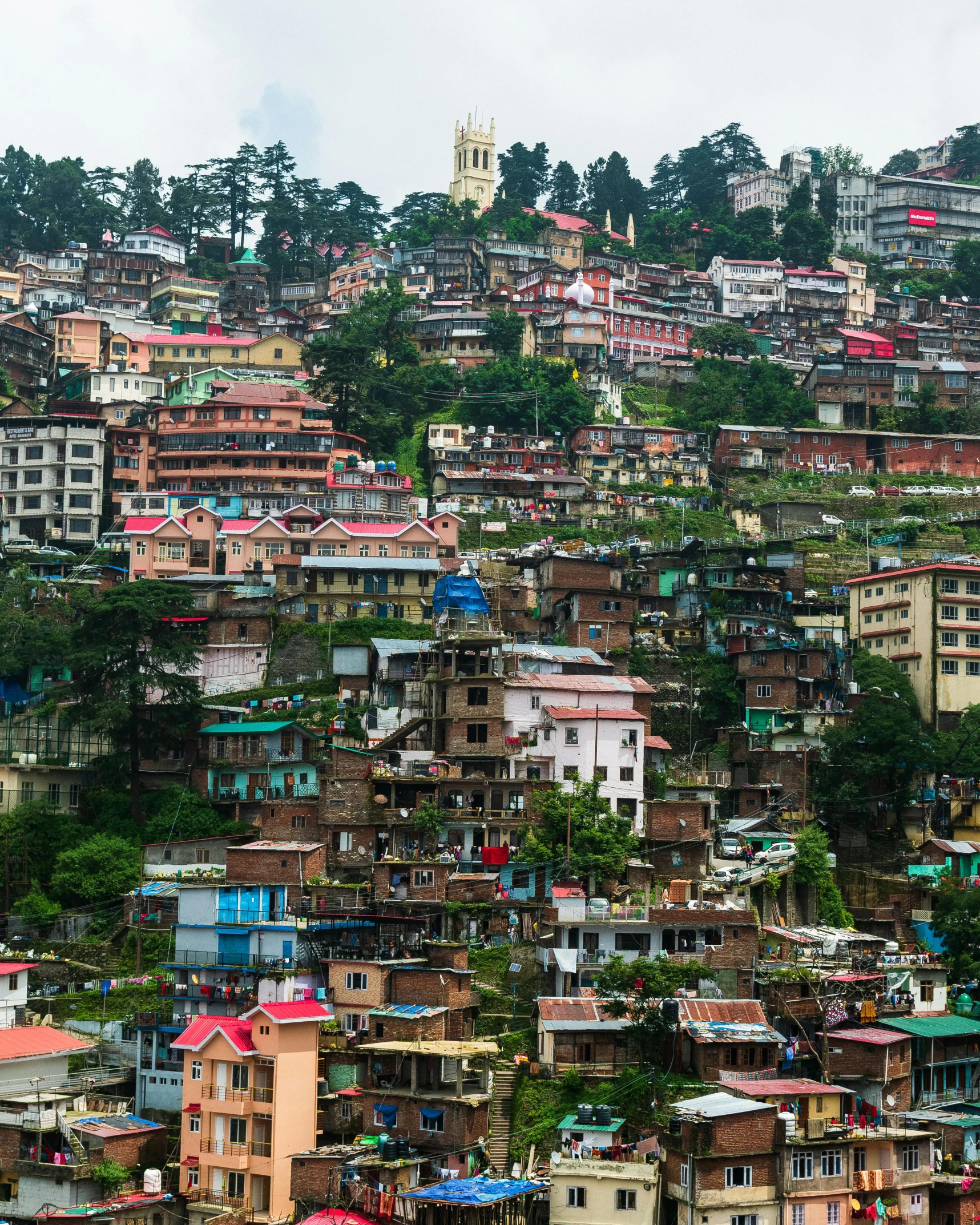 a large hill with lots of houses on it