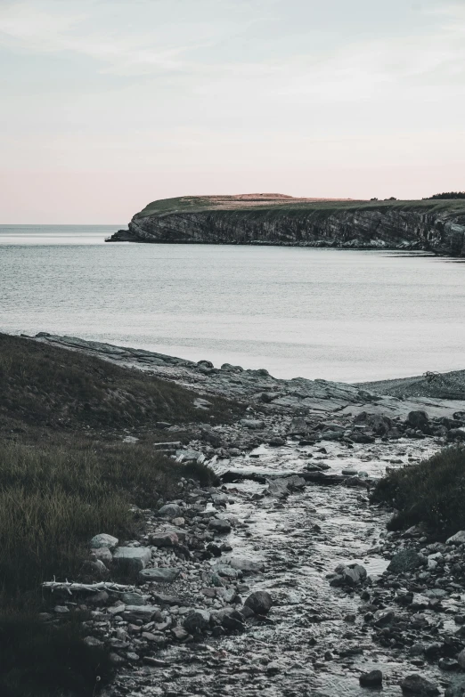 a boat is in the water at low tide