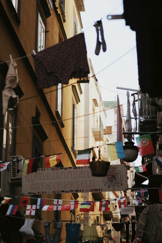 the city is full of hanging flags and shoes