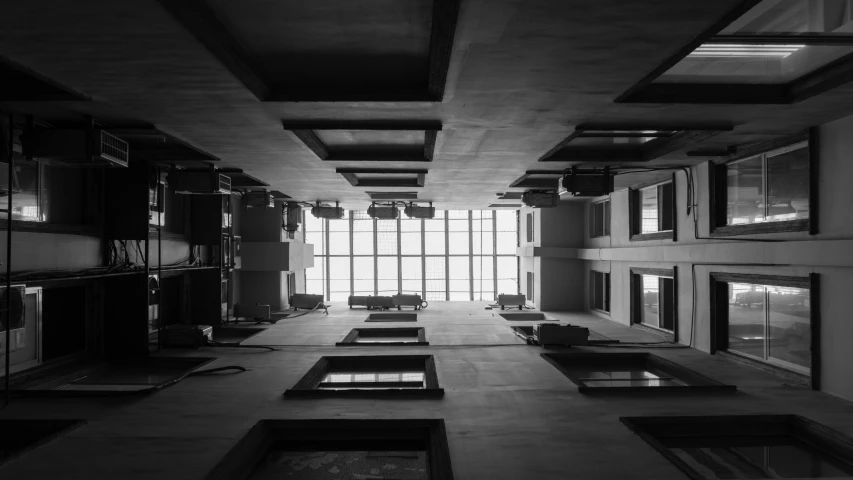 black and white pograph of a hallway inside of a building