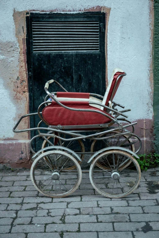 a horse drawn carriage parked outside of a building