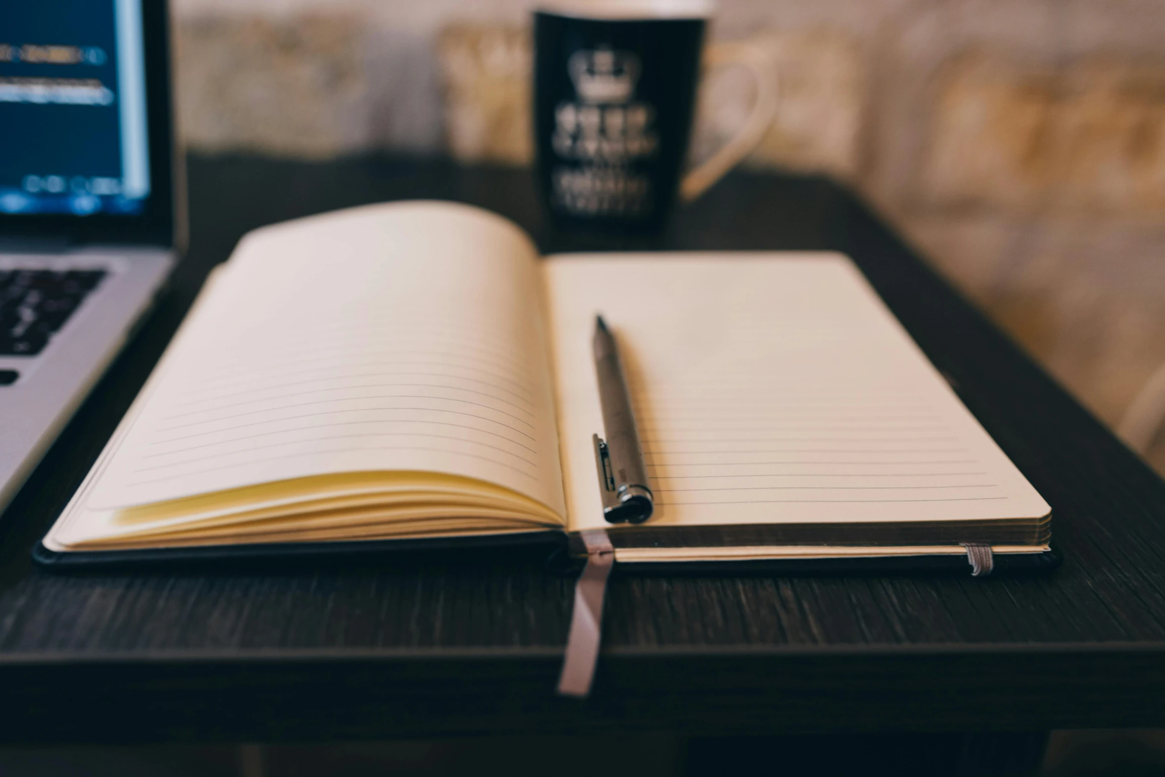 a book open on top of a wooden table