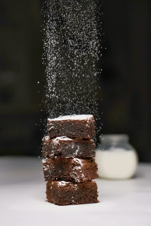 a stack of four brownies sitting on top of each other