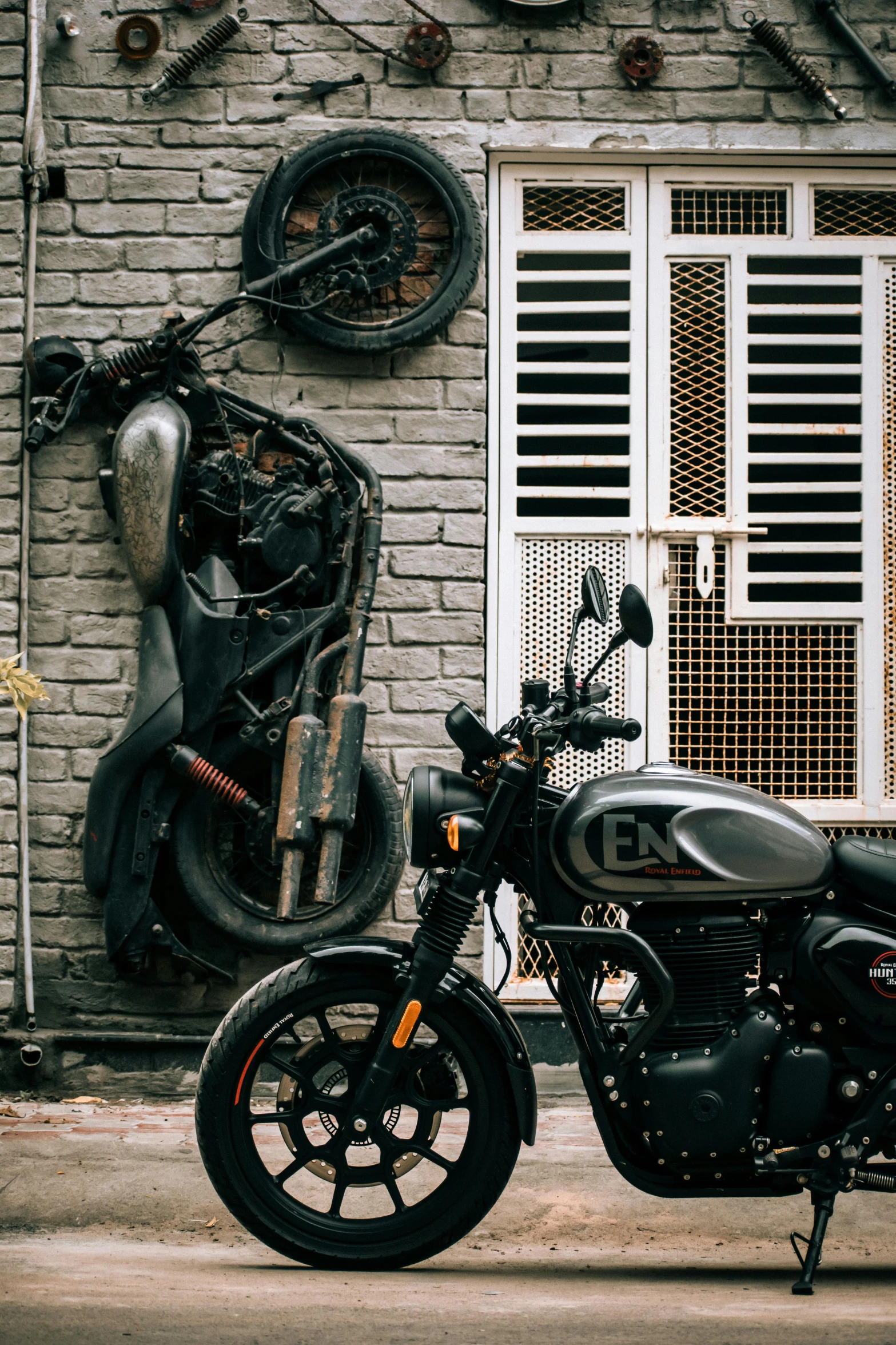 a motorcycle parked in front of a brick building