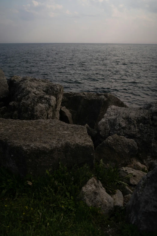 the ocean has lots of large rocks in it