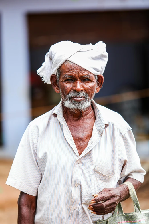 a man wearing a turban with a bag around his waist