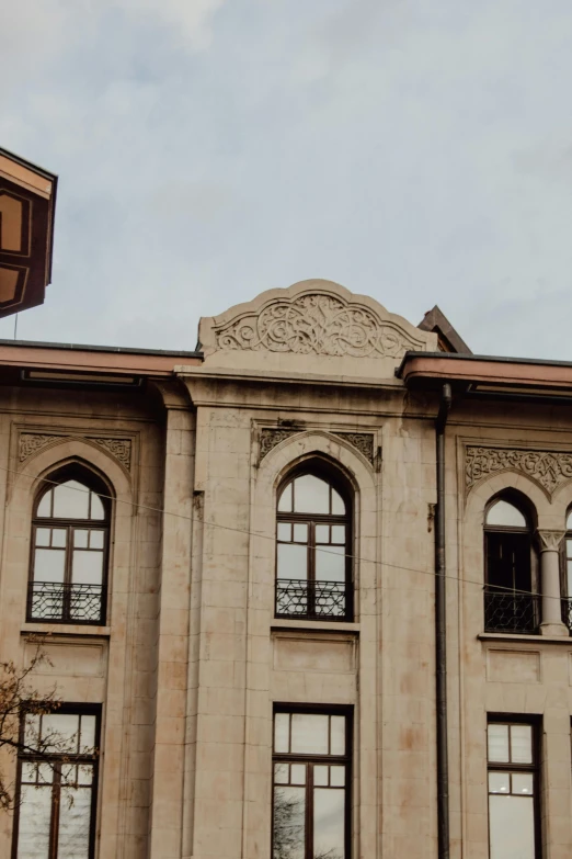 an old building with windows and a balcony