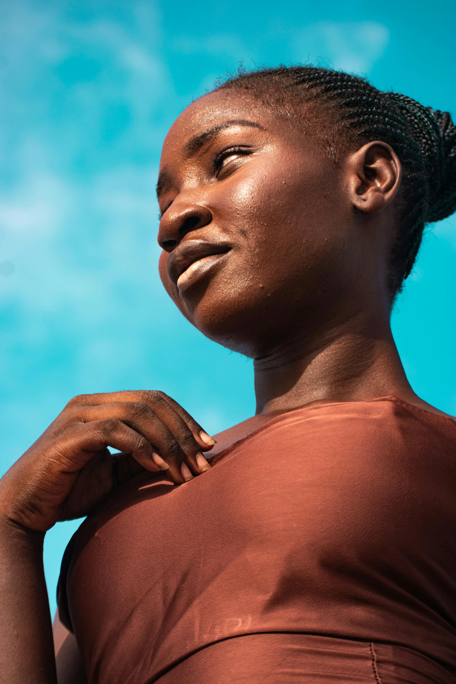 an image of a woman that is wearing a brown shirt