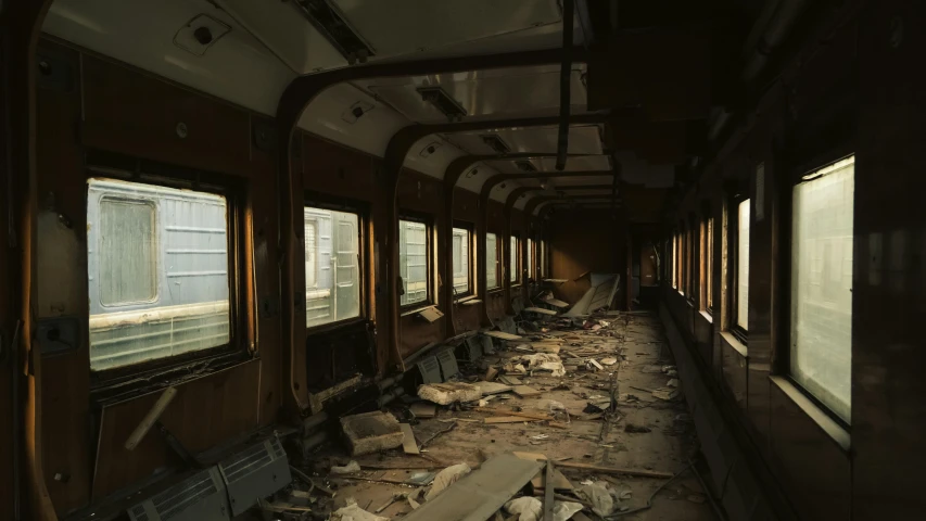 a subway train with rusted rails and broken windows