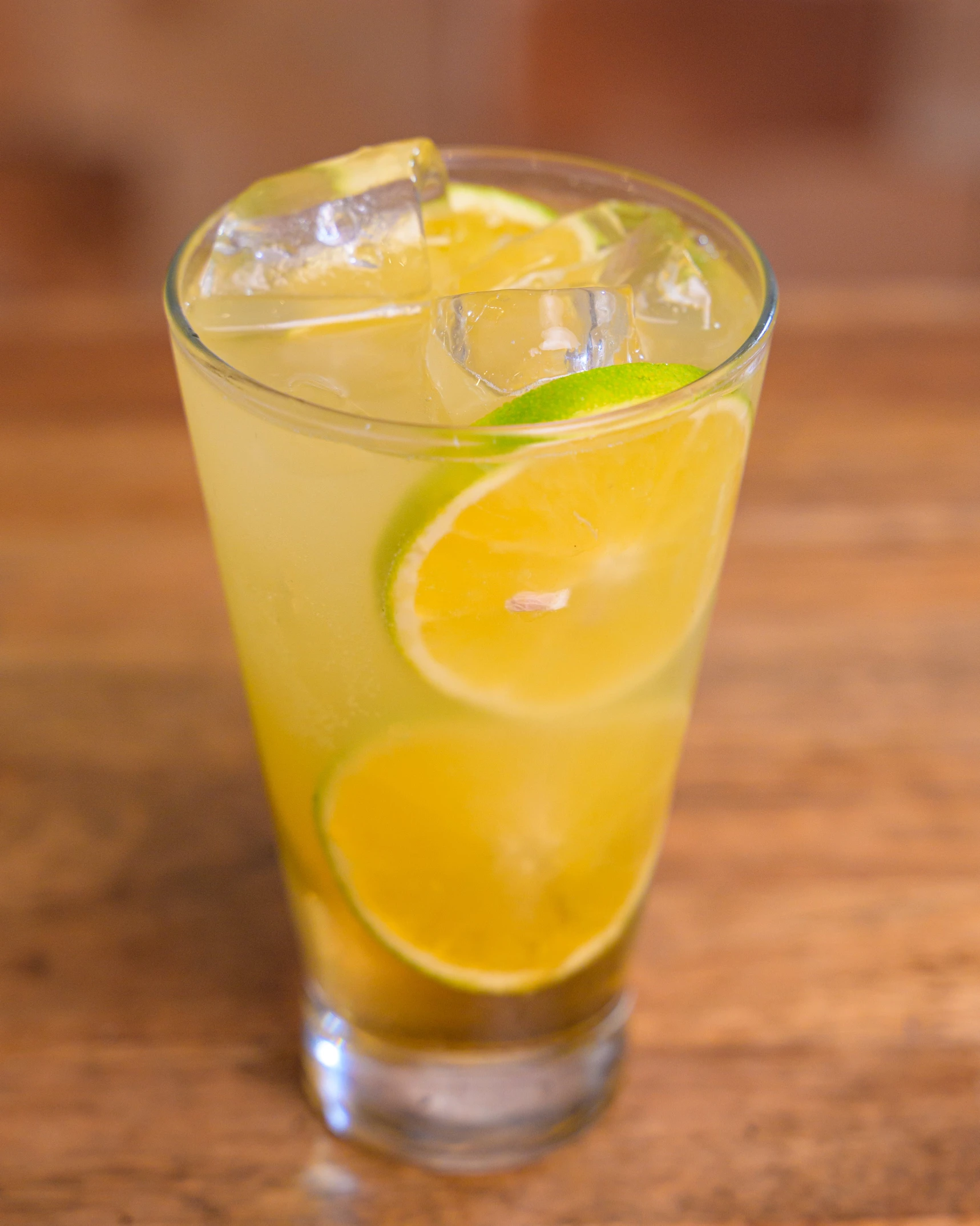 a glass with some lemon and lime juice