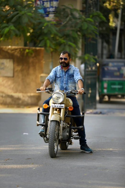 man on a motorcycle with a man sitting on the front