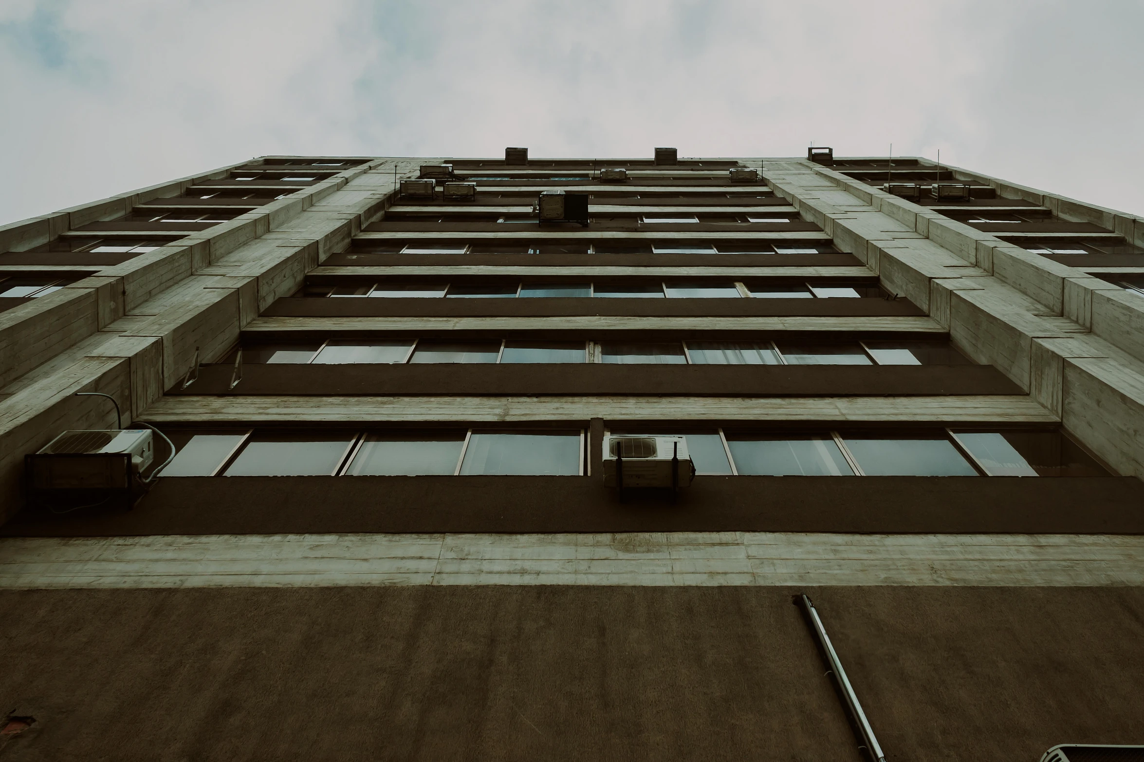 view looking up at the side of a tall building